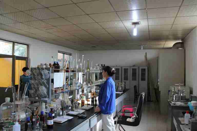 Laboratory staff running trials at the synthesis bench