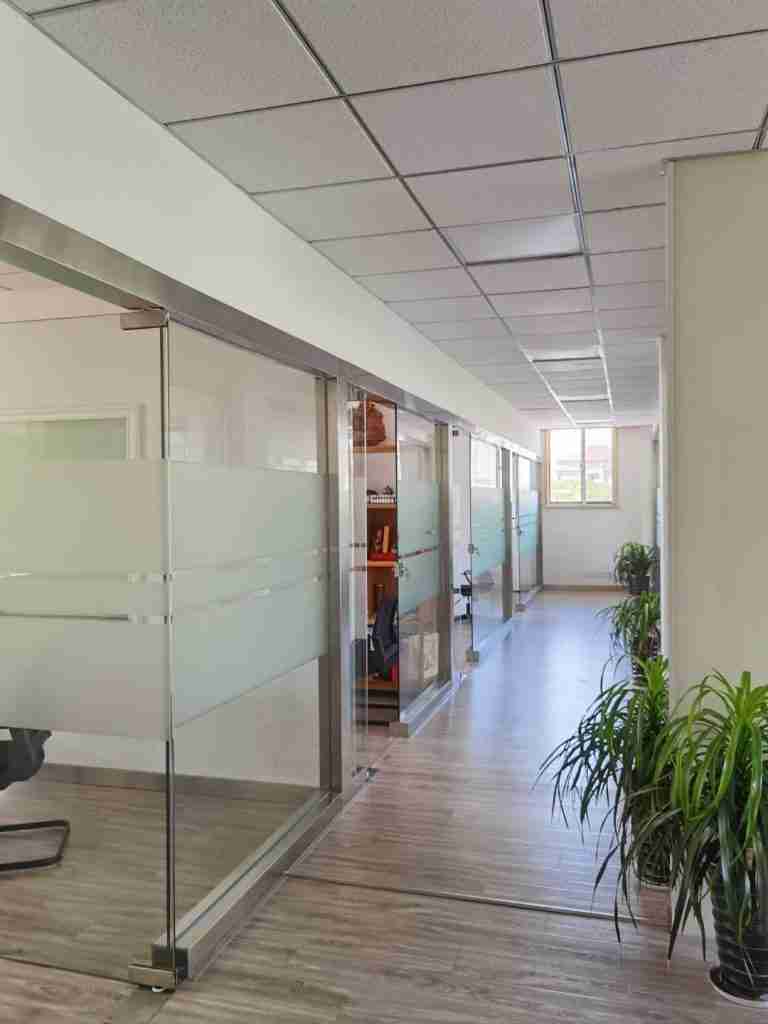 Office corridor with glass partitions