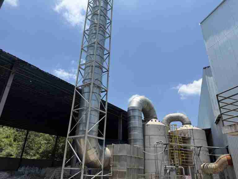 Dryer exhaust treatment at a lignosulfonate plant