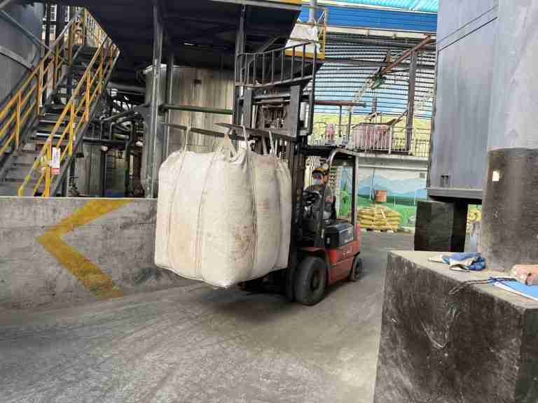 Forklift moving a lignosulfonate jumbo bag